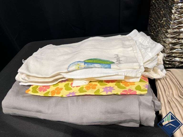 Basket Full of Tablecloths, Runners, and Napkins