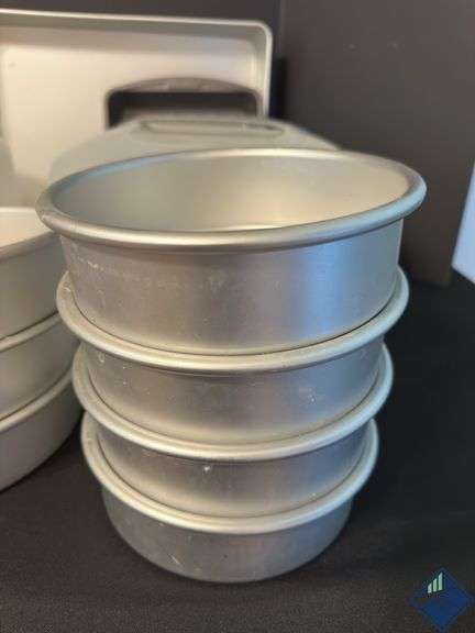 Assortment of Cake Pans and Cake Displays with Domes