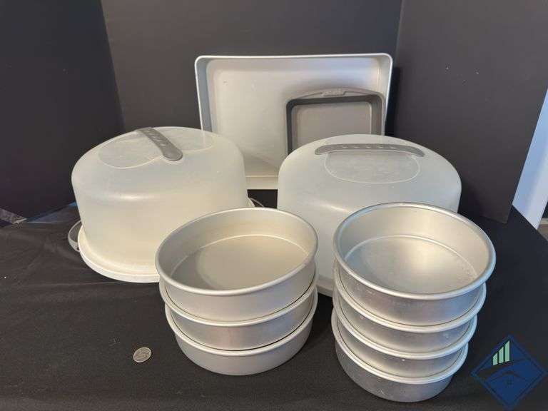 Assortment of Cake Pans and Cake Displays with Domes