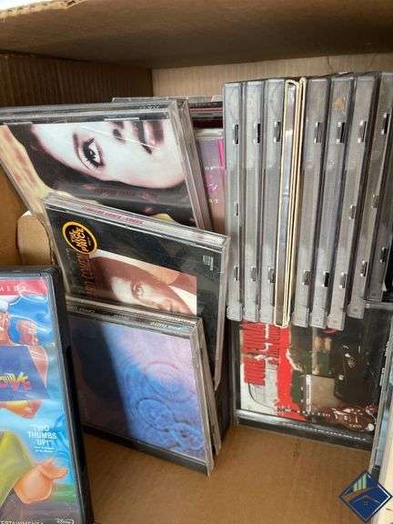 Box of CDs and DVDs