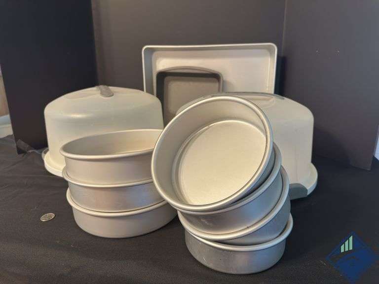 Assortment of Cake Pans and Cake Displays with Domes