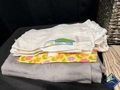 Basket Full of Tablecloths, Runners, and Napkins