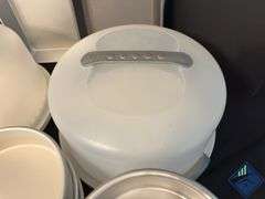 Assortment of Cake Pans and Cake Displays with Domes