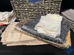 Basket Full of Tablecloths, Runners, and Napkins