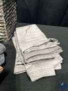 Basket Full of Tablecloths, Runners, and Napkins