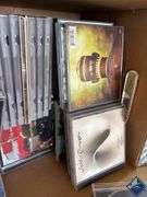 Box of CDs and DVDs
