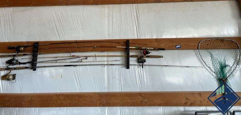 Fishing Rods, Reels, and Net on Wall-Mounted Rack