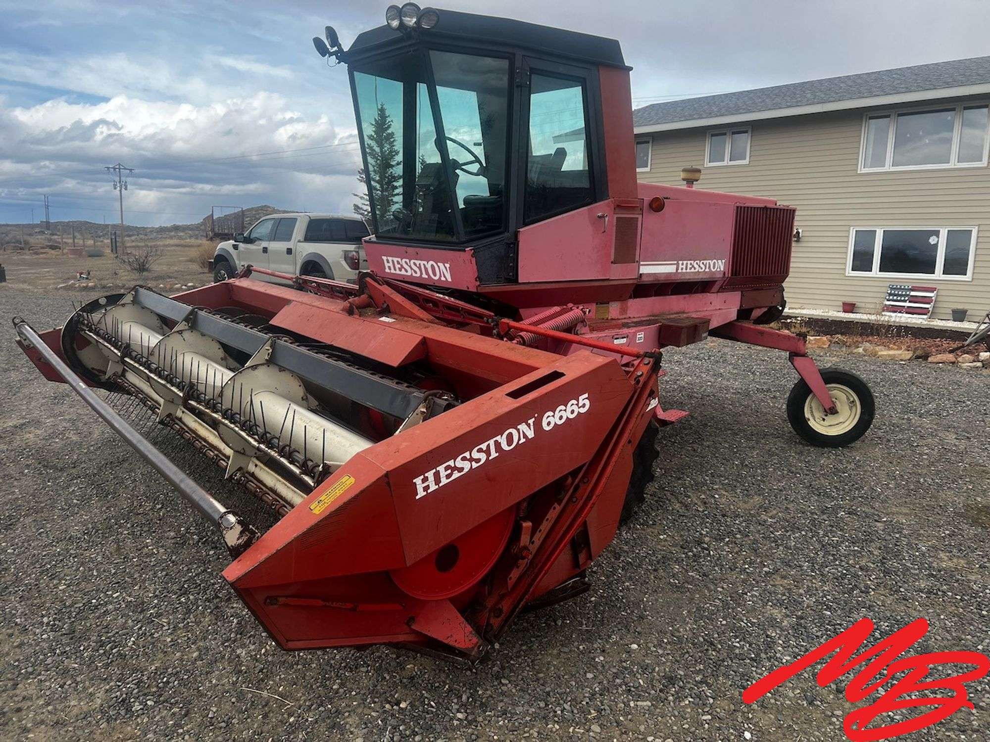 Hesston 6450 Swather w/ Hesston 6665 Header - Musser Bros Inc