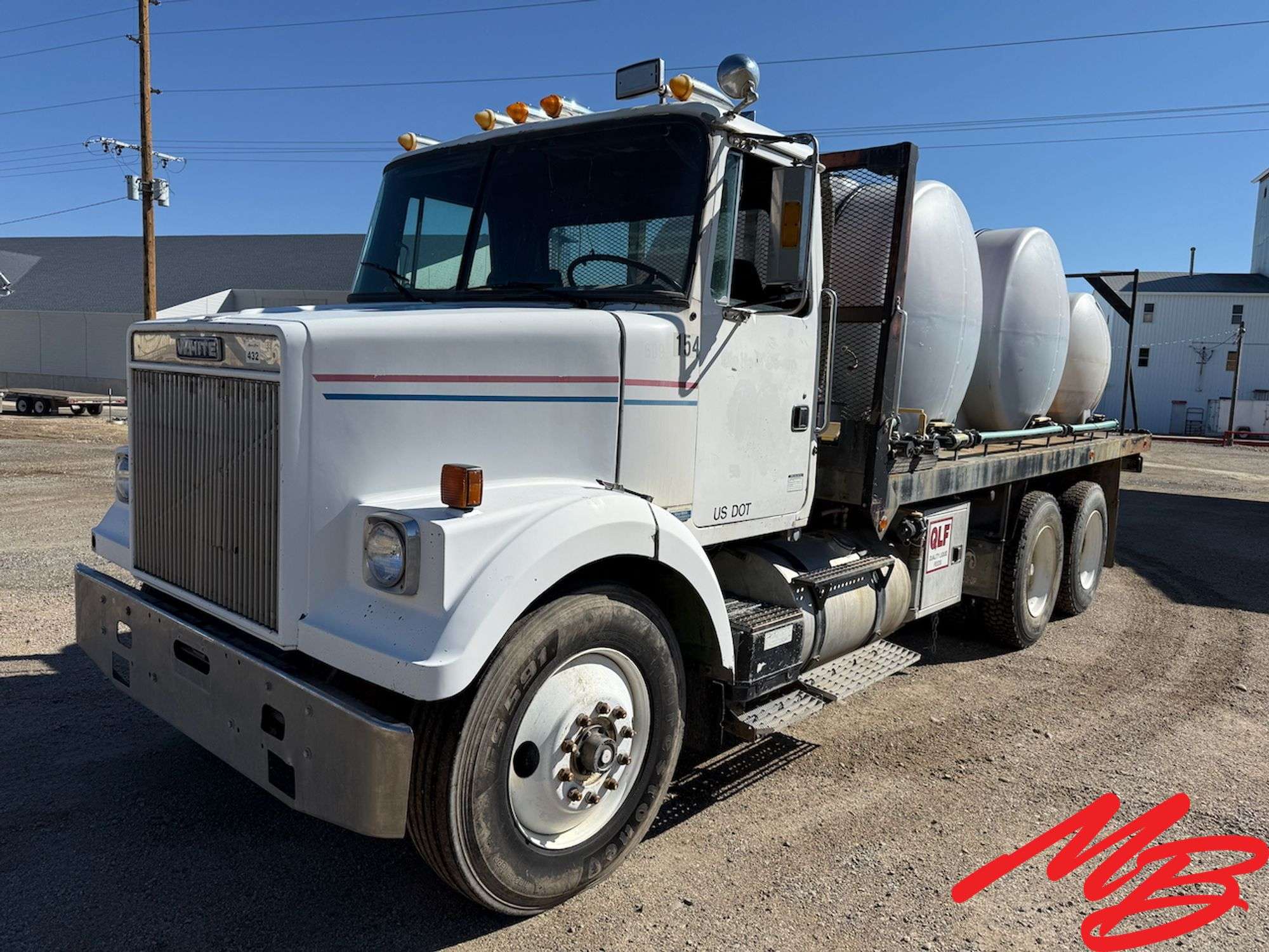 1986 White Flatbed Truck w/ (2) 925 Gallon Fertilizer Tanks and (1) 535 Gallon Fertilizer Tank