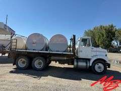 1986 White Flatbed Truck w/ (2) 925 Gallon Fertilizer Tanks and (1) 535 Gallon Fertilizer Tank