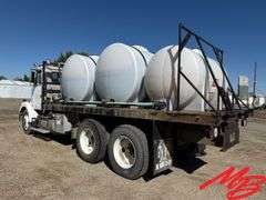 1986 White Flatbed Truck w/ (2) 925 Gallon Fertilizer Tanks and (1) 535 Gallon Fertilizer Tank