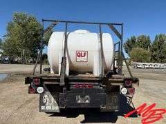 1986 White Flatbed Truck w/ (2) 925 Gallon Fertilizer Tanks and (1) 535 Gallon Fertilizer Tank