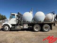 1986 White Flatbed Truck w/ (2) 925 Gallon Fertilizer Tanks and (1) 535 Gallon Fertilizer Tank