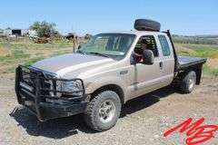 1999  Ford  F350 Super Duty XLT  Extended Cab 4X4 Flatbed Pickup