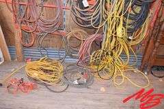Assorted extension cords, air hose & jumper cables