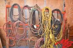 Assorted extension cords, air hose & jumper cables