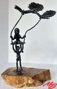 Kids Playing on Swing. Metal, 8-1/2"W x 12-3/4"H x 8"D